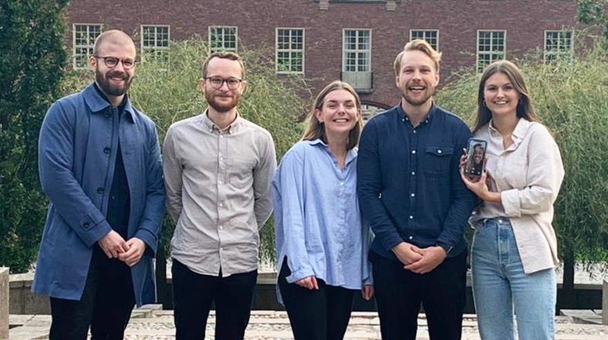 Five students in front of a KTH building.