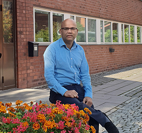 Dilip sitting outside